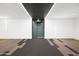 Modern hallway with patterned carpeting and sleek lighting at 2300 E Campbell Ave # 106, Phoenix, AZ 85016