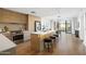 Modern kitchen featuring sleek cabinetry, stainless steel appliances, and an island with bar seating at 2300 E Campbell Ave # 106, Phoenix, AZ 85016