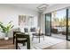 Bright living area with a plush white sofa, modern decor, and sliding glass doors to outdoor patio at 2300 E Campbell Ave # 106, Phoenix, AZ 85016