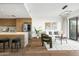 Bright living room featuring hardwood floors and a modern kitchen island with counter seating at 2300 E Campbell Ave # 106, Phoenix, AZ 85016