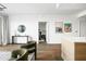 Spacious open-concept living room with wood floors and decoratively appointed side table at 2300 E Campbell Ave # 106, Phoenix, AZ 85016