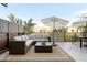 Comfortable outdoor patio lounge with a sectional sofa and coffee table at 2300 E Campbell Ave # 106, Phoenix, AZ 85016