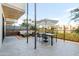 Stylish outdoor patio featuring a dining set and cozy lounge area with an umbrella for shade at 2300 E Campbell Ave # 106, Phoenix, AZ 85016