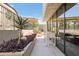Inviting outdoor patio space surrounded by lush landscaping, creating a serene and relaxing ambiance at 2300 E Campbell Ave # 106, Phoenix, AZ 85016