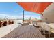 Stylish rooftop deck with comfortable lounge seating, shade, and city views, perfect for entertaining at 2300 E Campbell Ave # 106, Phoenix, AZ 85016