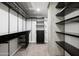 Spacious walk-in closet with custom shelving and drawers, providing ample storage space at 2300 E Campbell Ave # 106, Phoenix, AZ 85016
