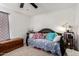 Cozy bedroom featuring a daybed, colorful pillows, and overhead lighting at 2431 E Tracy Ln # 1, Phoenix, AZ 85032