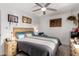 Comfortable bedroom featuring neutral tones, ceiling fan, and natural lighting at 2431 E Tracy Ln # 1, Phoenix, AZ 85032