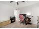 Multi-purpose bedroom or office space with a ceiling fan and a pink office chair at 2431 E Tracy Ln # 1, Phoenix, AZ 85032