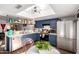 Charming kitchen featuring blue cabinets, stainless steel appliances, and a bright skylight at 2431 E Tracy Ln # 1, Phoenix, AZ 85032