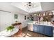 Charming kitchen with blue cabinets, white countertops, and easy access to the outdoors at 2431 E Tracy Ln # 1, Phoenix, AZ 85032