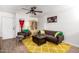 Comfortable living room with modern furnishings, including a plush sofa and patterned rug at 2431 E Tracy Ln # 1, Phoenix, AZ 85032