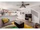 Open concept living room with bar seating, comfortable sofa, and easy access to the kitchen at 2431 E Tracy Ln # 1, Phoenix, AZ 85032