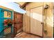 Private patio with vibrant plants, rustic wooden accents, and charming outdoor decor at 2431 E Tracy Ln # 1, Phoenix, AZ 85032
