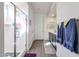 Modern bathroom with a glass-enclosed shower, wood-look floors, and a sleek vanity at 27053 W Ponderosa Ln, Buckeye, AZ 85396