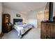Cozy bedroom with carpeted floors and ample natural light at 27053 W Ponderosa Ln, Buckeye, AZ 85396