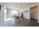 Inviting dining room with wood floors, natural light, and cozy atmosphere at 27053 W Ponderosa Ln, Buckeye, AZ 85396