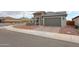 Charming single-story home featuring a stone facade and a well-manicured, low-maintenance landscape at 27053 W Ponderosa Ln, Buckeye, AZ 85396