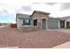 Charming single-Gathering home featuring low maintenance desert landscaping and an attached two car garage at 27053 W Ponderosa Ln, Buckeye, AZ 85396