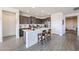 Beautiful kitchen with quartz counters, stainless steel appliances, and center island at 27053 W Ponderosa Ln, Buckeye, AZ 85396