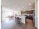 Open concept kitchen with island and breakfast bar adjacent to dining area at 27053 W Ponderosa Ln, Buckeye, AZ 85396