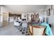 Spacious living room offering modern furniture, wood plank floors and open floor plan at 27053 W Ponderosa Ln, Buckeye, AZ 85396