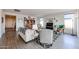 Bright living room with comfortable seating, stylish decor, and wood plank floors at 27053 W Ponderosa Ln, Buckeye, AZ 85396