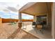 Covered patio with room for outdoor seating at 27053 W Ponderosa Ln, Buckeye, AZ 85396