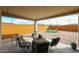 Covered patio area with ample space for outdoor seating and entertaining at 27053 W Ponderosa Ln, Buckeye, AZ 85396