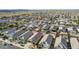 Aerial view of neighborhood homes with desert landscape and mountain views at 30954 W Whitton Ave, Buckeye, AZ 85396