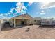 Expansive backyard featuring gravel, fire pit, a covered patio, and a trampoline at 30954 W Whitton Ave, Buckeye, AZ 85396