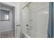 Bright bathroom featuring a tiled shower and bathtub at 30954 W Whitton Ave, Buckeye, AZ 85396