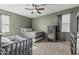 Cozy bedroom features a neutral color palette and ceiling fan at 30954 W Whitton Ave, Buckeye, AZ 85396
