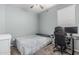 Cozy bedroom featuring a ceiling fan, neutral walls, and space for work or relaxation at 30954 W Whitton Ave, Buckeye, AZ 85396