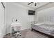 Bright bedroom with a modern vanity, white walls, window, and comfortable bed at 30954 W Whitton Ave, Buckeye, AZ 85396