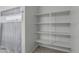Walk-in closet boasts shelving, hanging space, and natural lighting at 30954 W Whitton Ave, Buckeye, AZ 85396