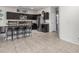 Charming kitchen features dark cabinetry and modern stainless steel appliances at 30954 W Whitton Ave, Buckeye, AZ 85396