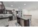 Kitchen with granite countertops, stainless appliances and center island with seating at 30954 W Whitton Ave, Buckeye, AZ 85396