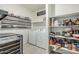 Convenient laundry room with washer, dryer, and shelving at 30954 W Whitton Ave, Buckeye, AZ 85396