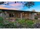 Expansive covered patio overlooking a serene koi pond and lush landscaping at 315 E Marlette Ave, Phoenix, AZ 85012