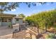 Backyard with built-in BBQ, raised garden, and mature vegetation at 315 E Marlette Ave, Phoenix, AZ 85012