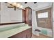 Cozy bathroom with tiled shower over tub, dark wooden vanity, and ample storage at 315 E Marlette Ave, Phoenix, AZ 85012