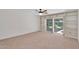Cozy bedroom with built-in shelving and a sliding glass door leading to the backyard at 315 E Marlette Ave, Phoenix, AZ 85012