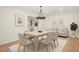 Bright dining room with modern chandelier and an adjacent seating area, offering a cozy and inviting atmosphere at 315 E Marlette Ave, Phoenix, AZ 85012