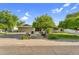 Charming single-story home boasts mature trees, a well-manicured lawn, and inviting curb appeal at 315 E Marlette Ave, Phoenix, AZ 85012