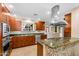 Updated kitchen boasts custom cabinets, granite countertops, and stainless steel appliances at 315 E Marlette Ave, Phoenix, AZ 85012
