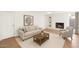 Inviting living room featuring a fireplace, neutral color scheme, and natural light at 315 E Marlette Ave, Phoenix, AZ 85012