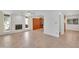 Open-concept living room features a white brick fireplace and access to the updated kitchen at 315 E Marlette Ave, Phoenix, AZ 85012