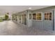 Covered back patio of home with brick flooring and ceiling fan at 315 E Marlette Ave, Phoenix, AZ 85012