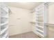 Walk-in closet with open shelving, offering ample storage at 315 E Marlette Ave, Phoenix, AZ 85012